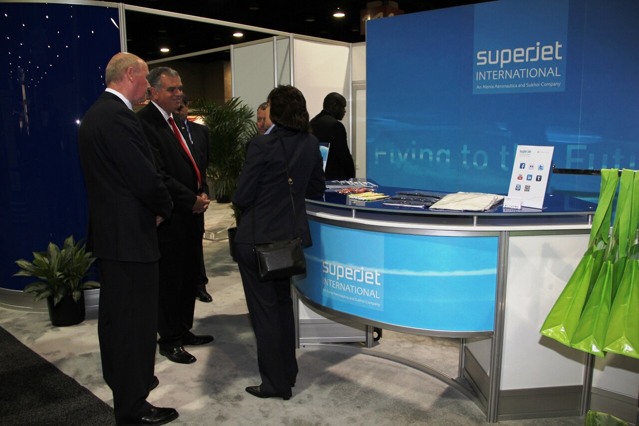 Business people talking at a trade show booth