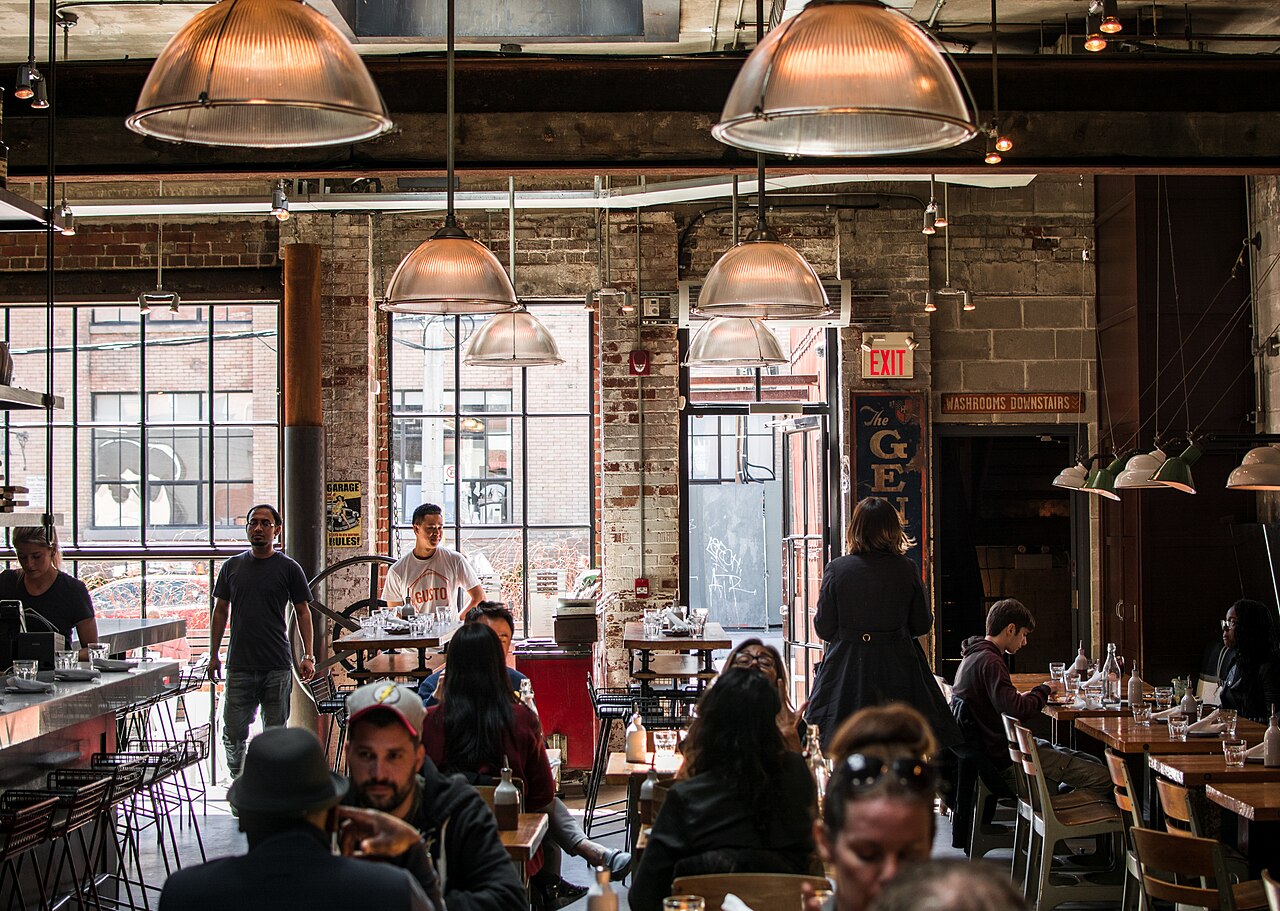 Busy modern restaurant interior with people dining