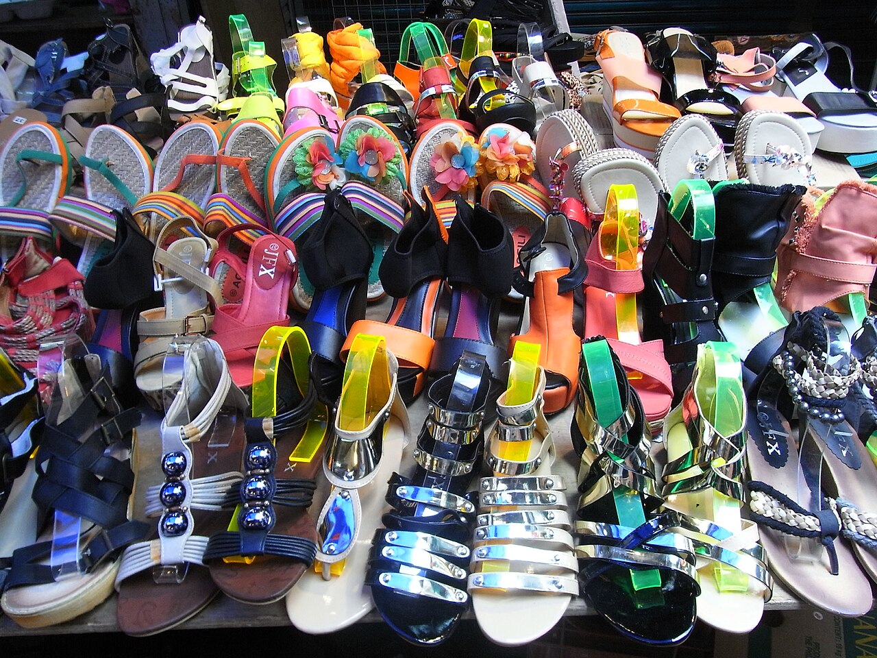 Colourful sandals and shoes displayed in a shop