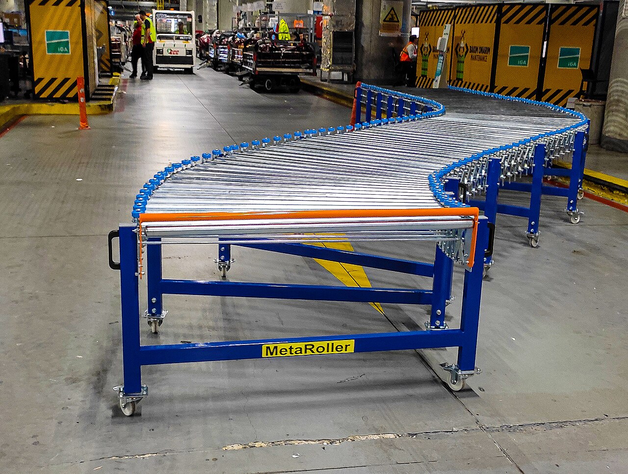 Blue roller conveyors in a warehouse